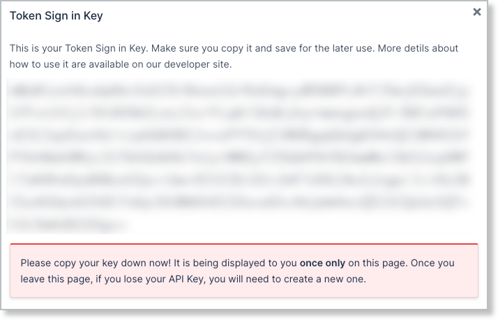 Token Sign in Key dialog with the key masked, warning that it is displayed only once and a new one must be created if lost